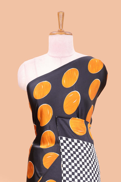 Black satin modal saree with orange polka print, contrast checked pallu, and printed blouse