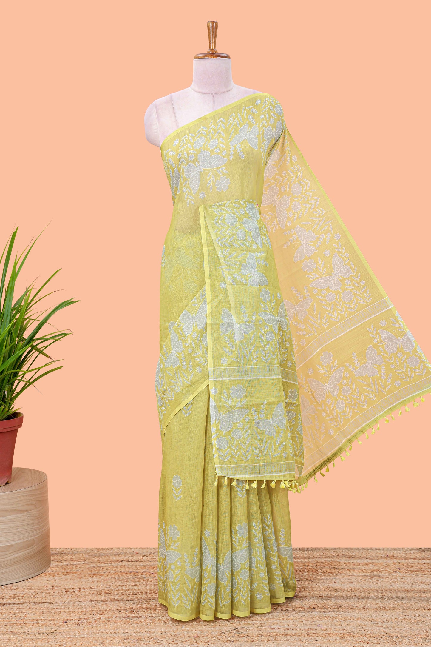 Green linen cotton saree with floral buttas and butterfly motifs border, Printed self pallu and blouse