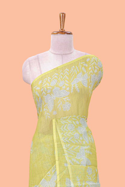 Green linen cotton saree with floral buttas and butterfly motifs border, Printed self pallu and blouse