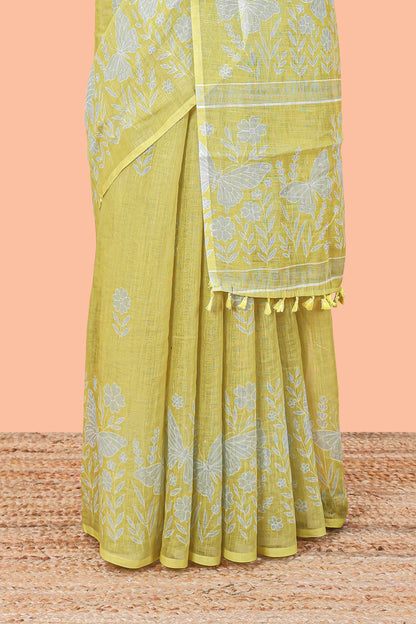 Green linen cotton saree with floral buttas and butterfly motifs border, Printed self pallu and blouse