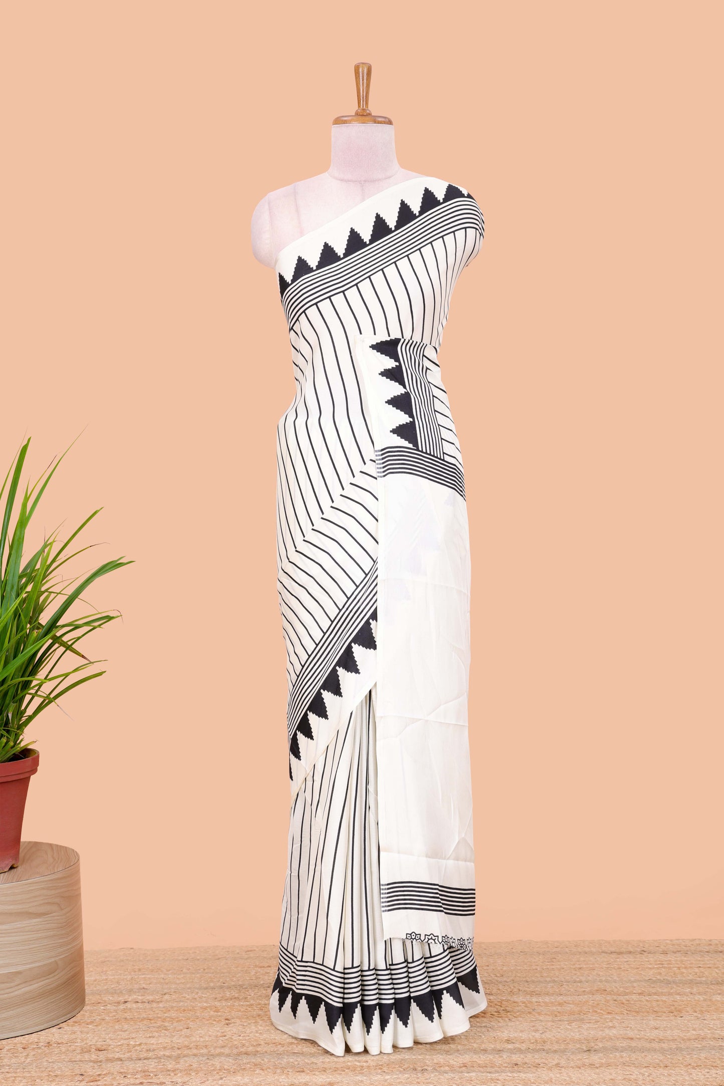 White satin ajrakh modal printed saree with striped body and geometric print border and pallu