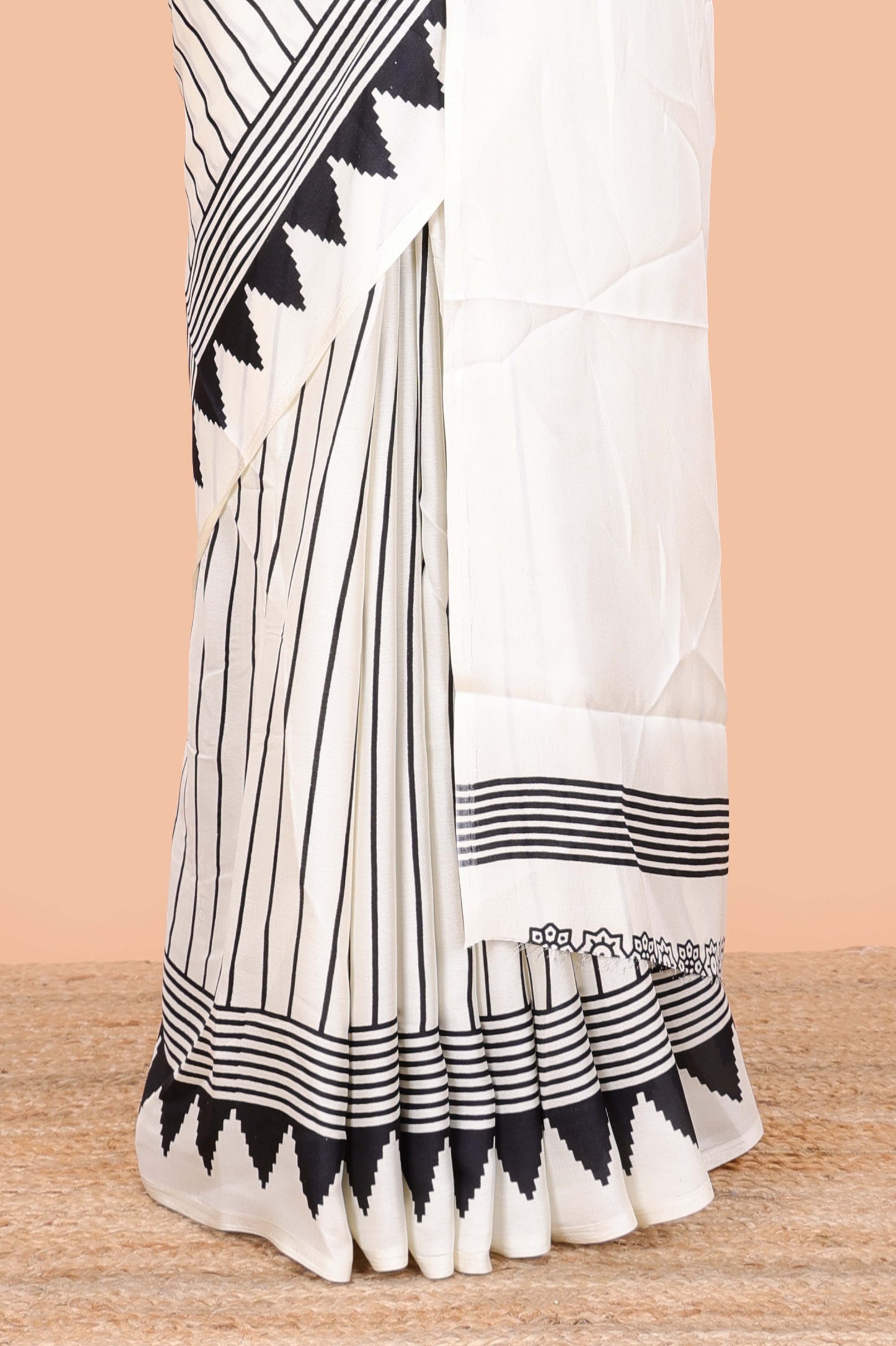 White satin ajrakh modal printed saree with striped body and geometric print border and pallu