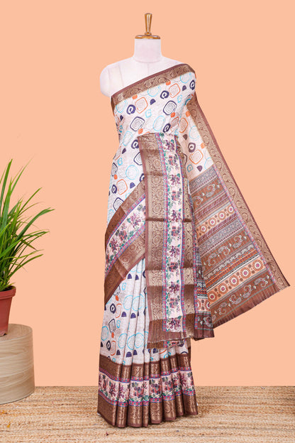 Cream zari striped geometric design art silk saree with brown retta petta border and printed pallu