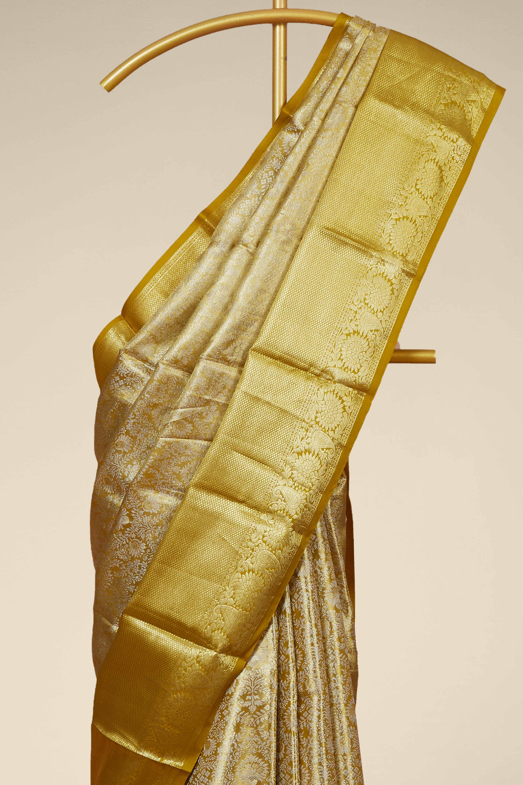 Gold Tissue Kancheepuram Pattu With Zari Border And Floral Woven Design