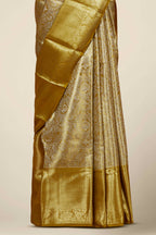 Gold Tissue Kancheepuram Pattu With Zari Border And Floral Woven Design