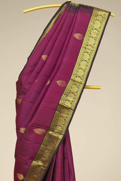 Kanchipuram Traditional Silk Saree in Deep Magenta with Gold Zari Buttas and Contrast Border