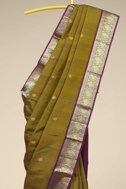 Kanchipuram Traditional Silk Saree in Olive Green with Silver Zari Buttas and Purple Contrast Border