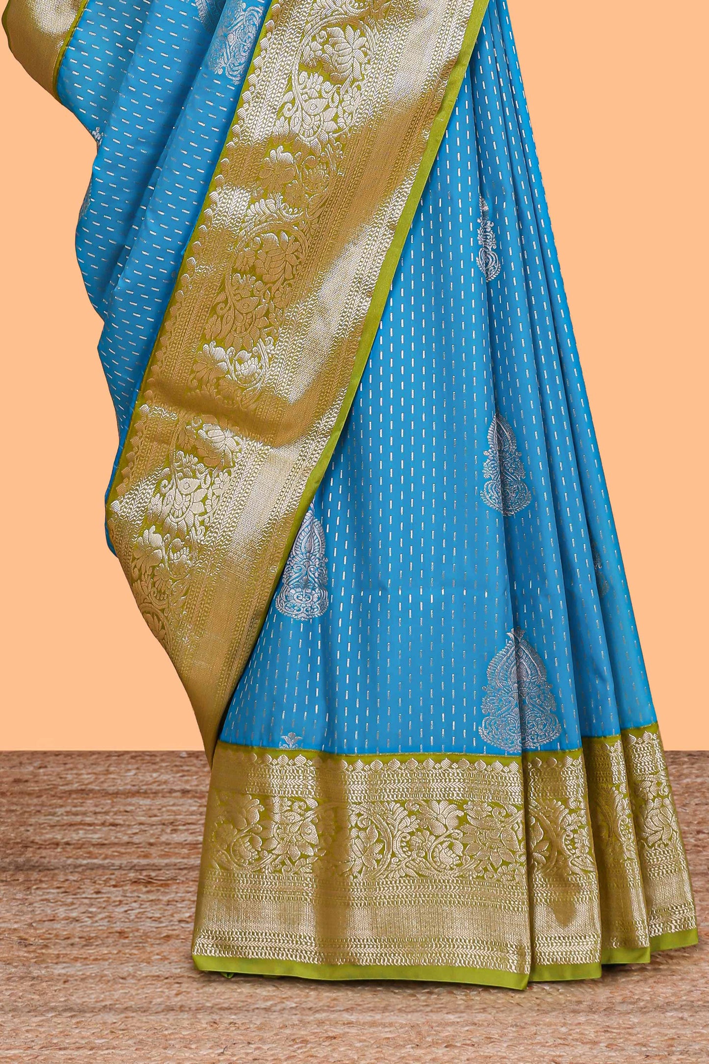 Blue zari butta design semi soft silk saree with contrast border and pallu