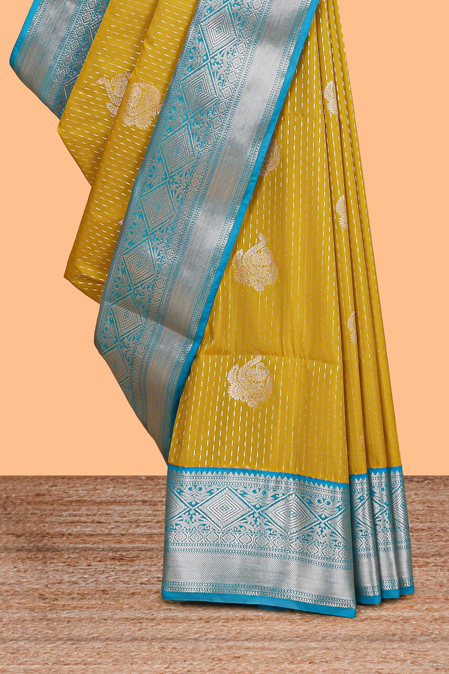 Mustard zari butta design semi soft silk saree with contrast border and pallu