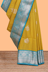 Mustard zari butta design semi soft silk saree with contrast border and pallu