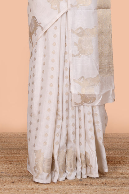 White viscose dola silk saree with zari butta weave, pichwai motif border and contrast blouse