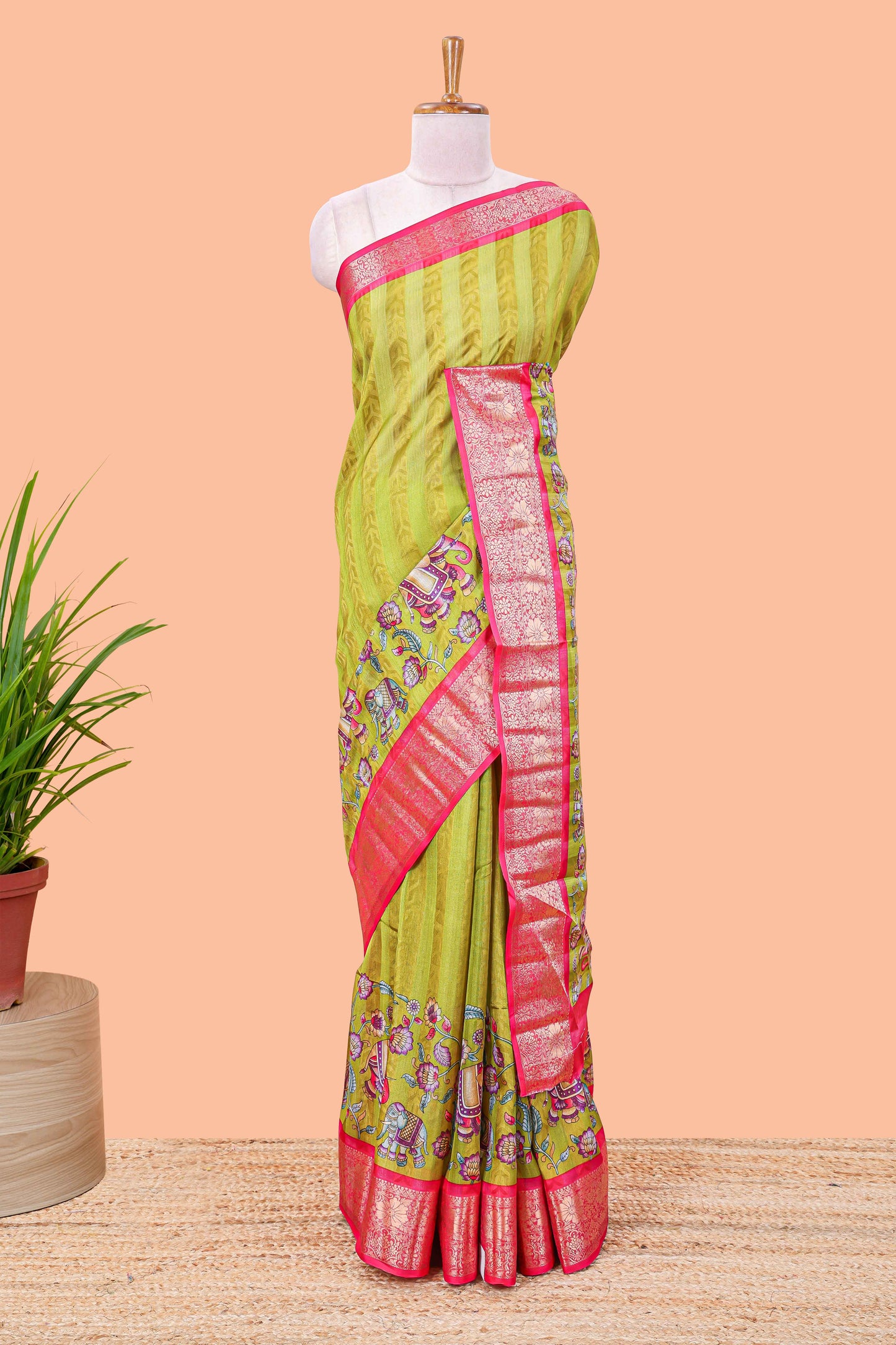 Green striped floral and elephant themed marsh georgette saree with contrast zari border and printed pallu