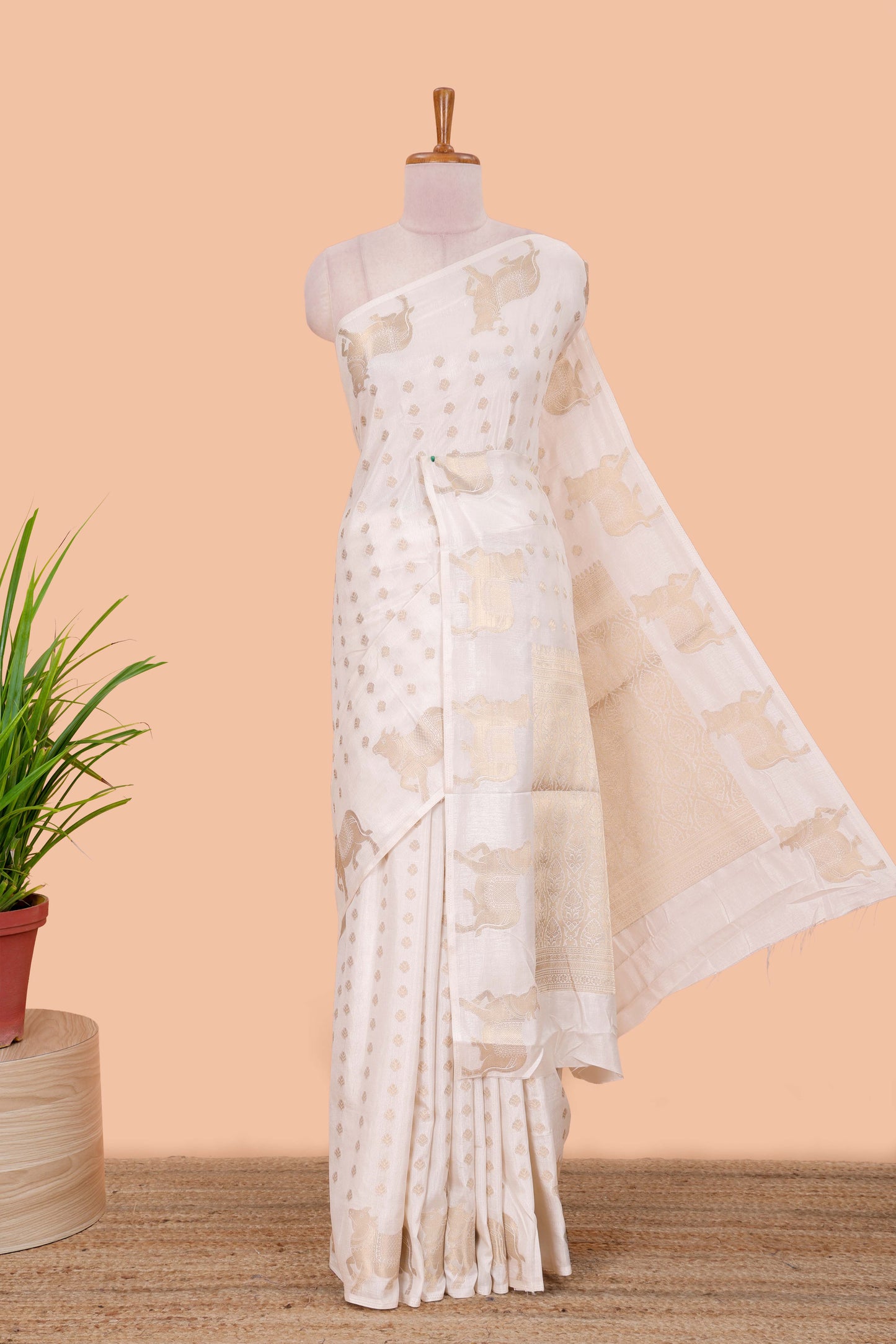 White viscose dola silk saree with zari butta weave, pichwai motif border and contrast blouse