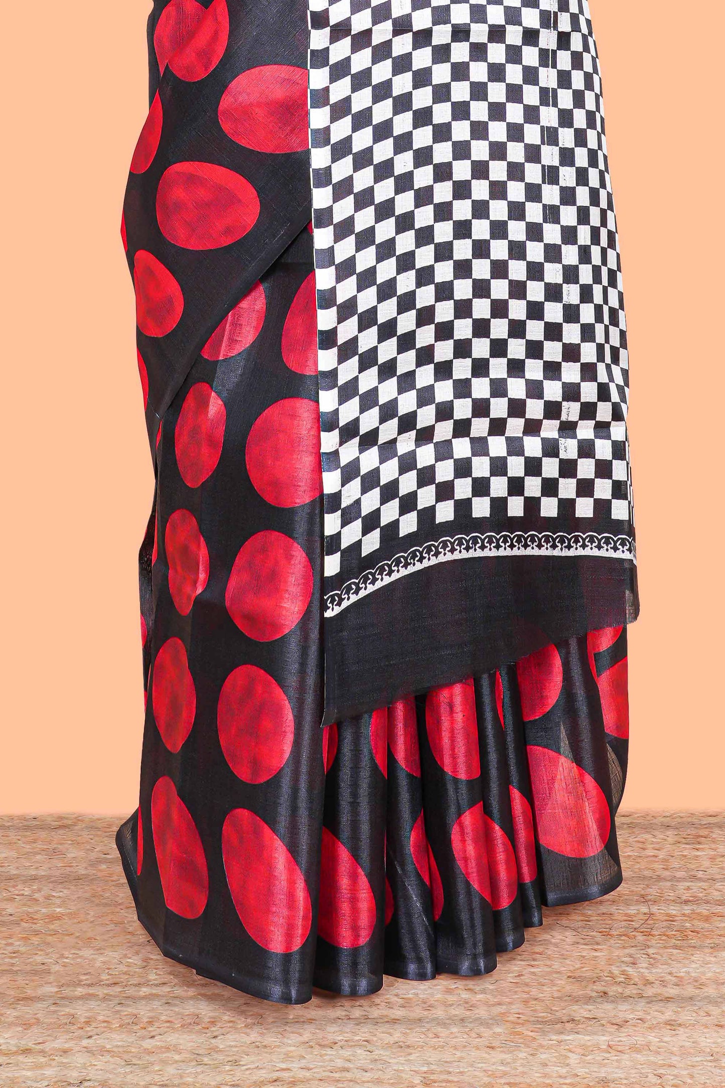 Borderless red khadi cotton saree with adire batik print and chess board pallu
