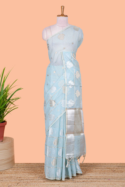 Blue floral zari butta linen tissue saree with zari border and contrast blouse