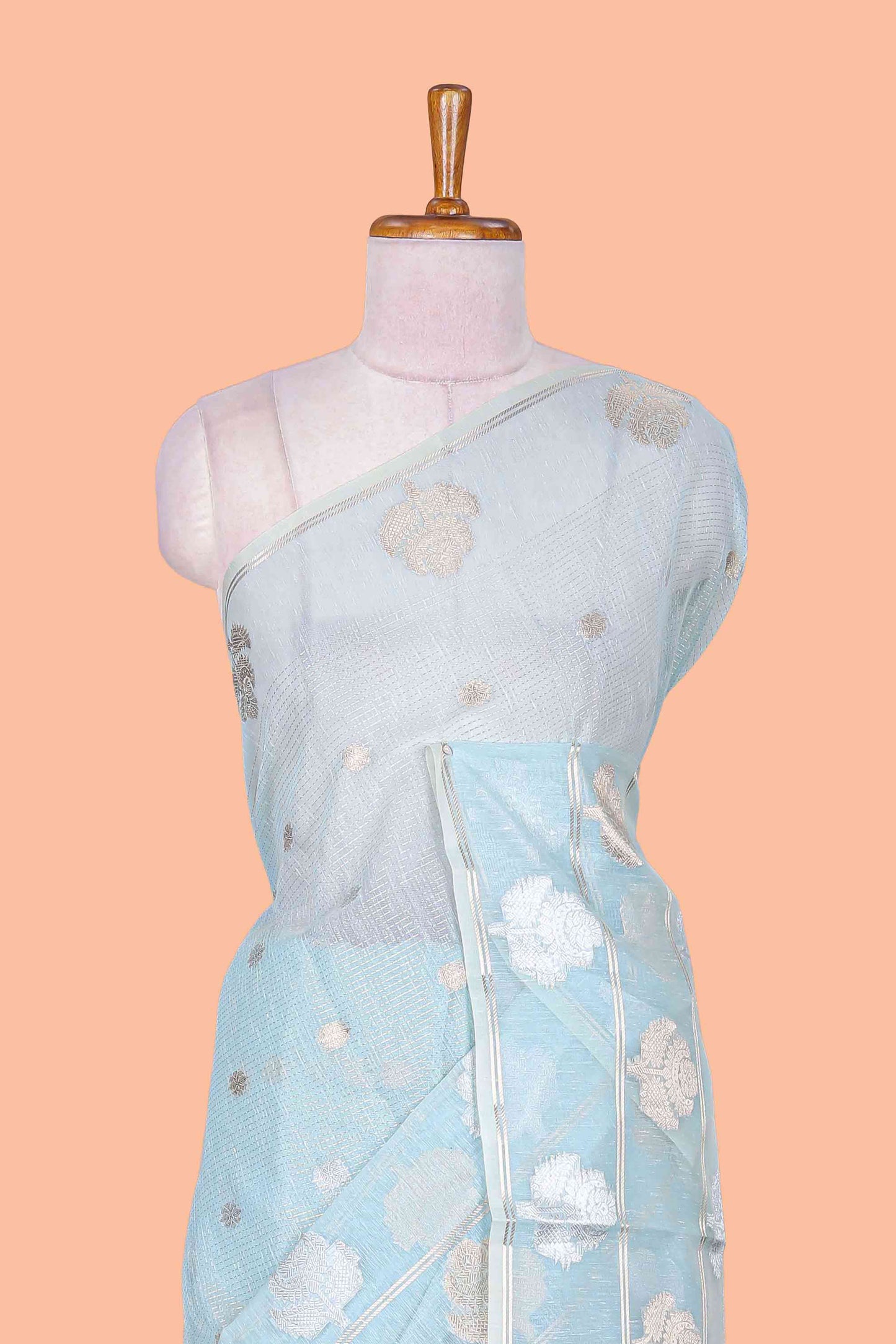 Blue floral zari butta linen tissue saree with zari border and contrast blouse