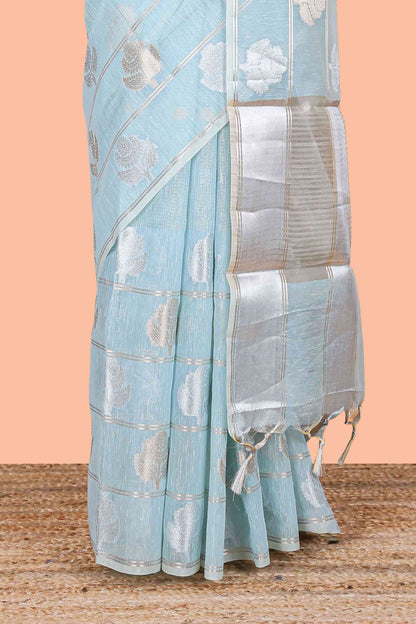 Blue floral zari butta linen tissue saree with zari border and contrast blouse