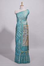 Teal green warli printed semi tussar saree with contrast warli printed pallu and matching blouse