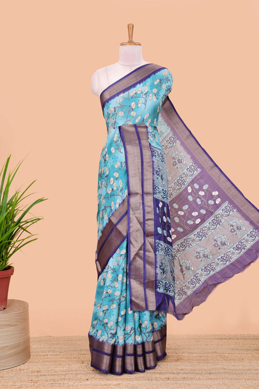 Blue moss chiffon floral printed saree with contrast jacquard border and jari line blouse
