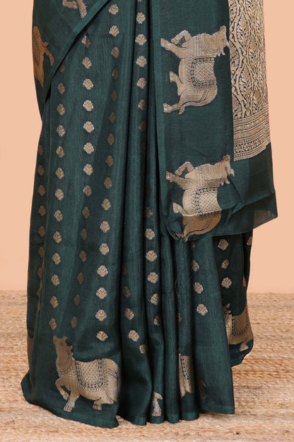Green viscose dola silk saree with zari butta weave, pichwai motif border and contrast blouse