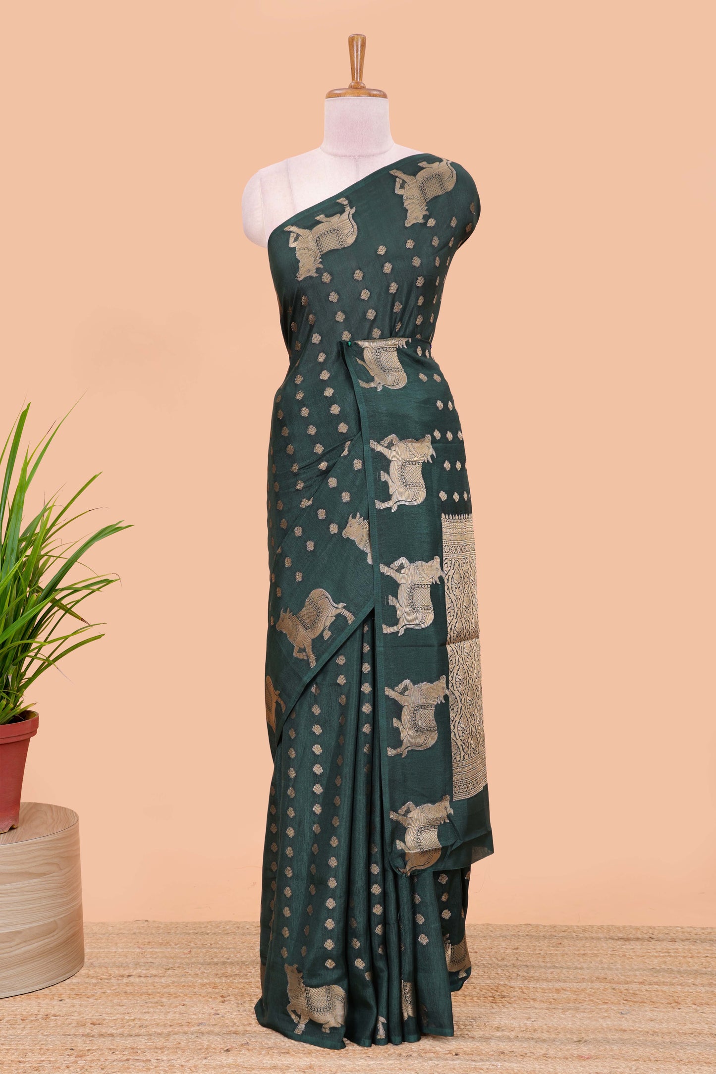 Green viscose dola silk saree with zari butta weave, pichwai motif border and contrast blouse