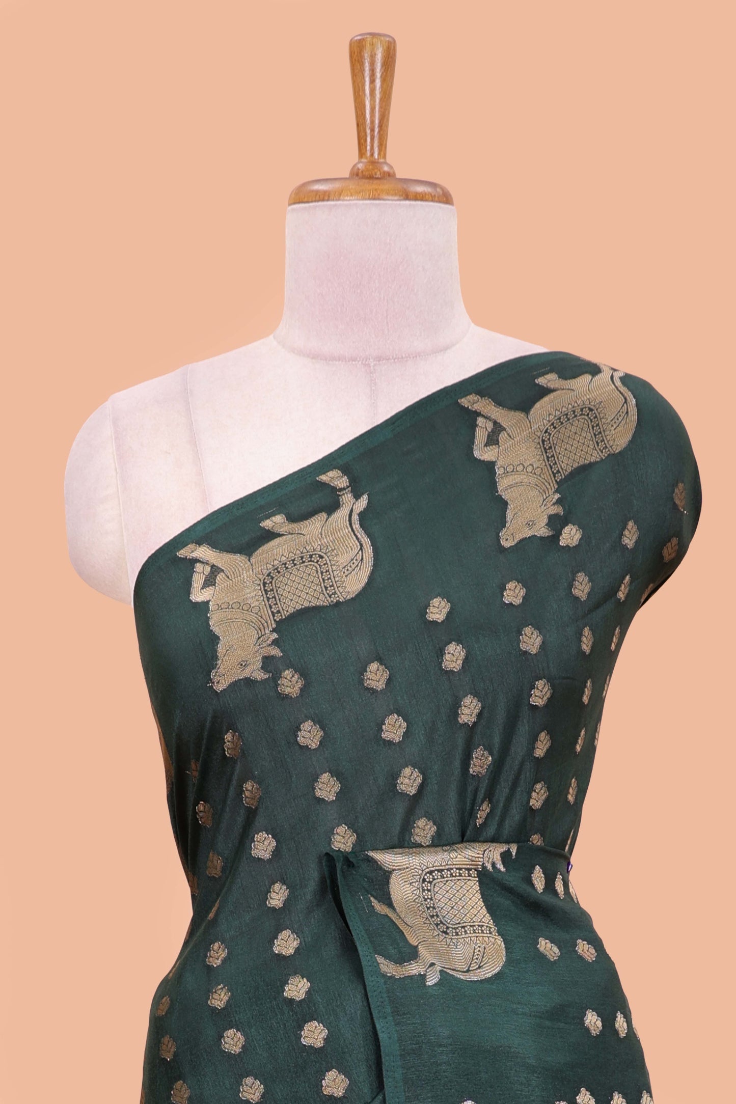 Green viscose dola silk saree with zari butta weave, pichwai motif border and contrast blouse