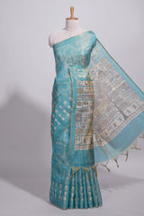 Teal green warli printed semi tussar sareewith contrast warli printed pallu and matching blouse