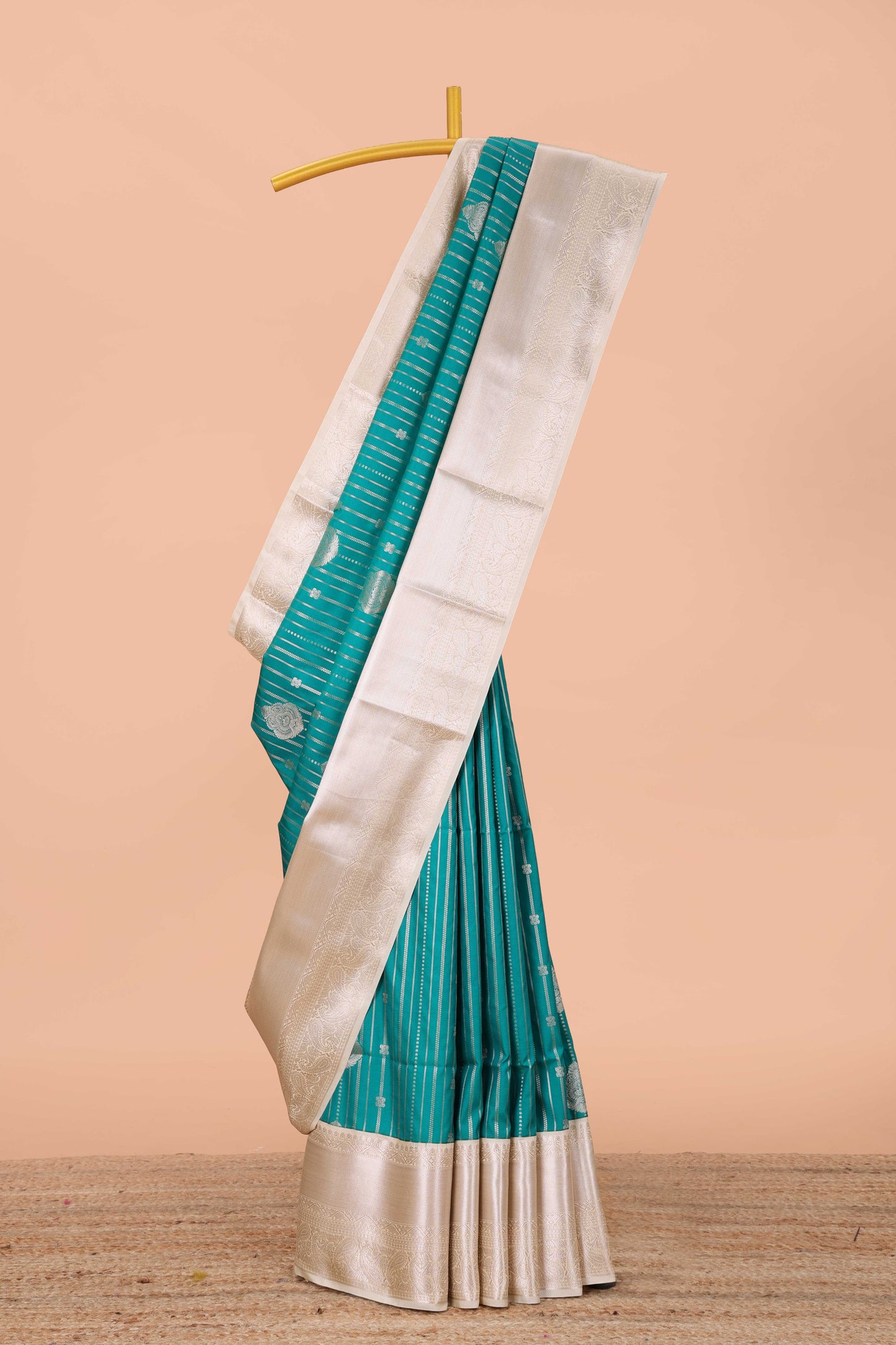 Blue semi soft silk banarasi style saree with gold zari stripes and contrast border