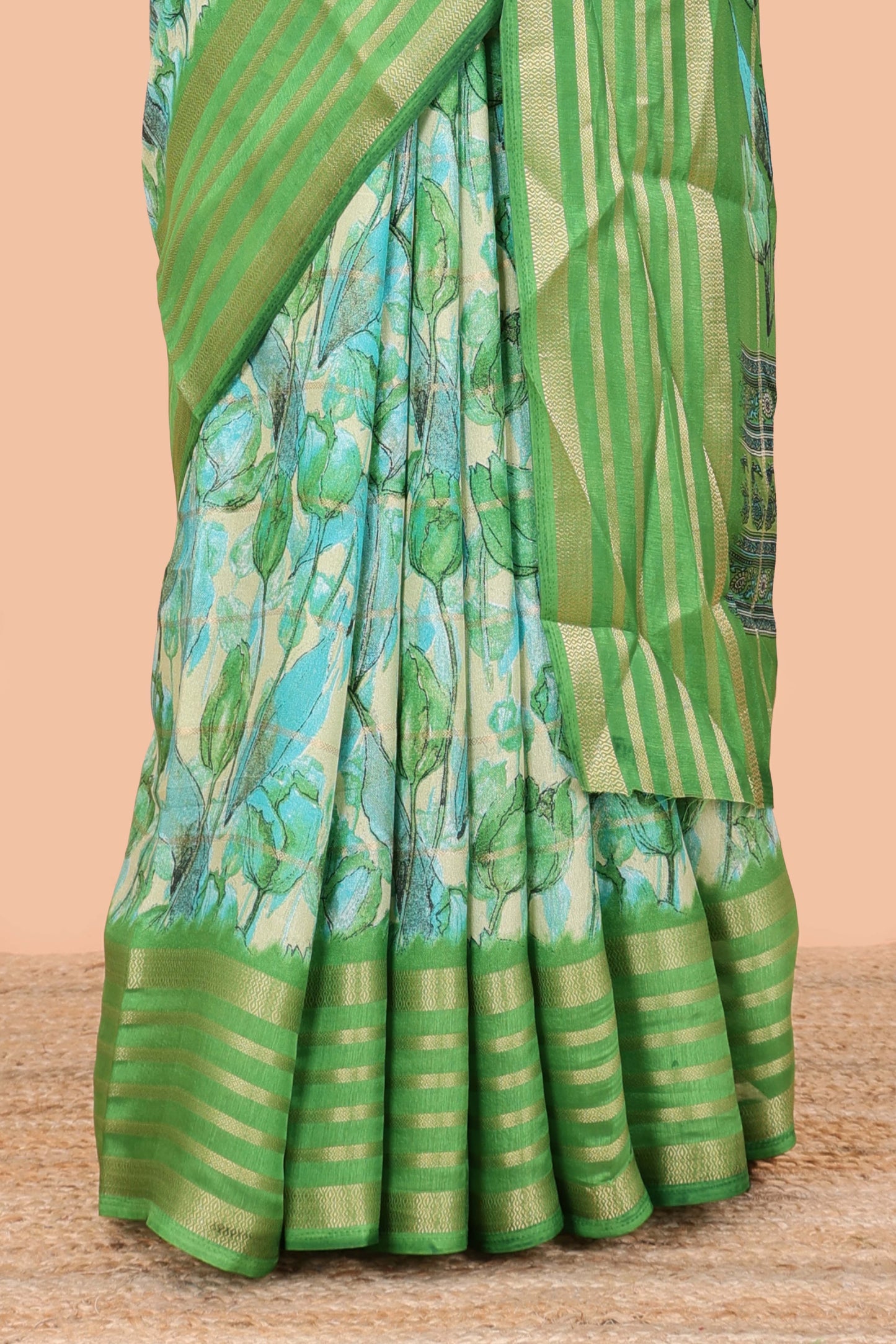 Green moss chiffon saree with striped floral print, contrast zari border and pallu