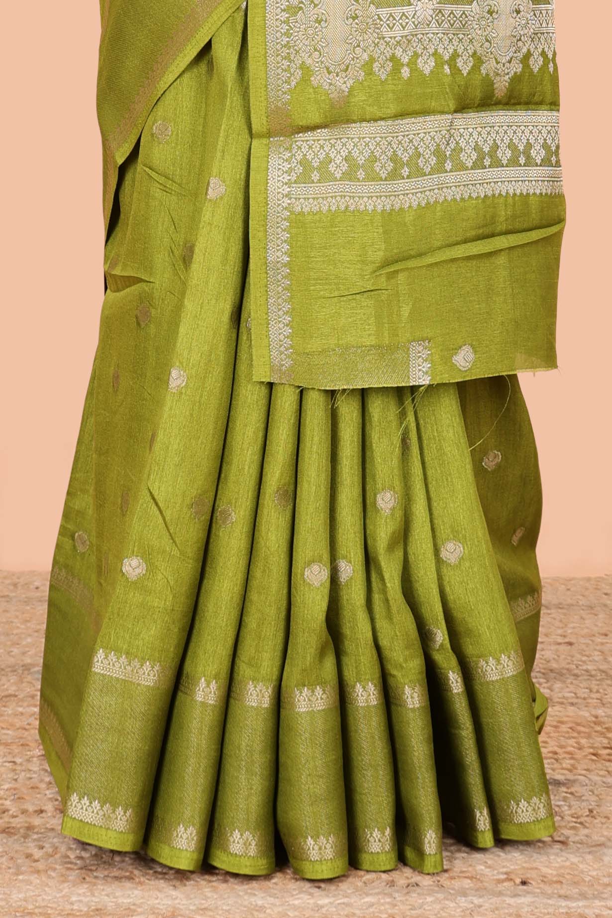 Green dola silk saree with all over zari butta, bendex zari border, rich zari pallu and contrast blouse