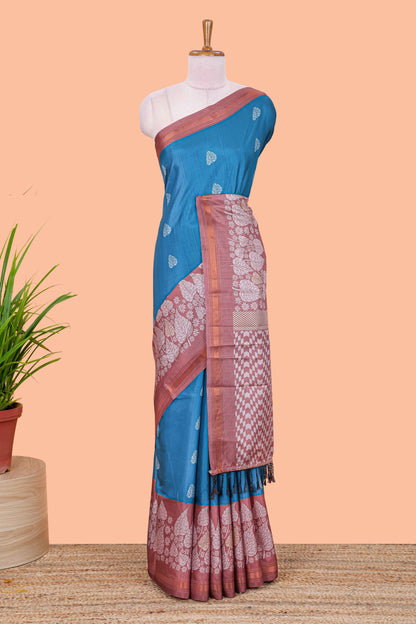 Blue leaf print semi tussar saree with contrast border and geometric pallu