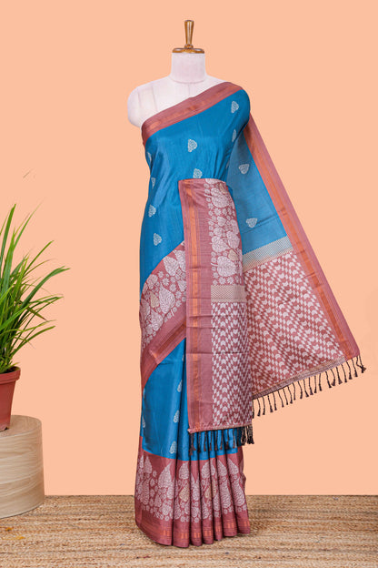 Blue leaf print semi tussar saree with contrast border and geometric pallu