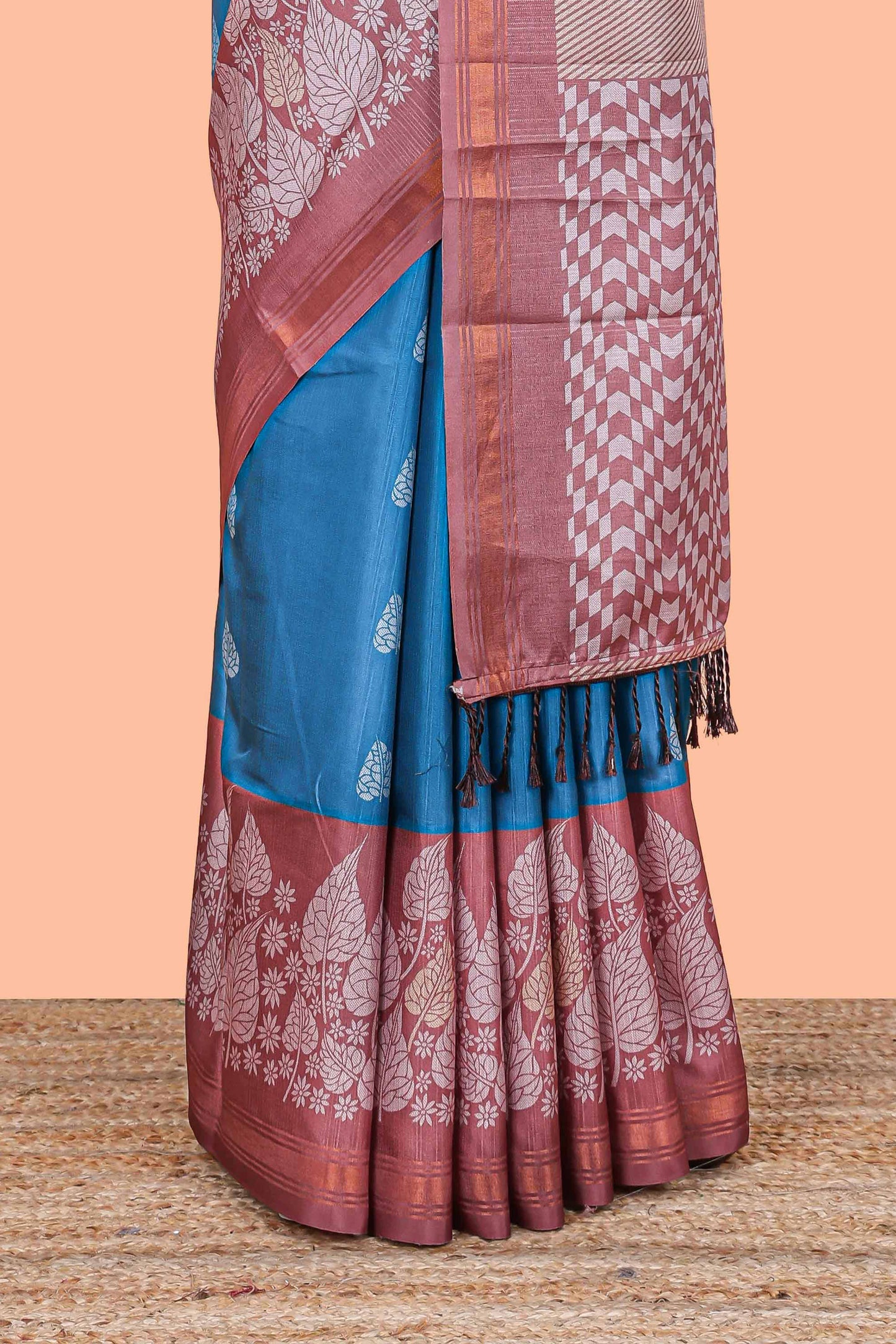Blue leaf print semi tussar saree with contrast border and geometric pallu