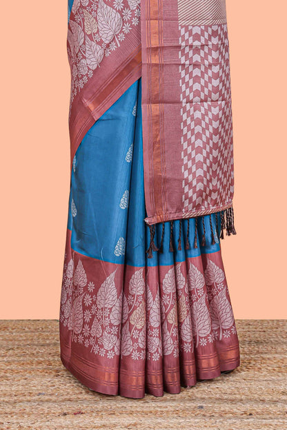 Blue leaf print semi tussar saree with contrast border and geometric pallu