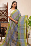 Green done Tones semi tussarall over saree Subtle Stripe and Checked pattern along with Tassels and Contrast Blouse