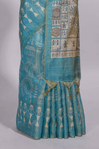 Teal green warli printed semi tussar saree with contrast warli printed pallu and matching blouse