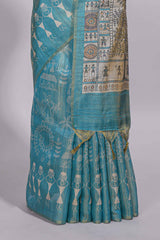 Teal green warli printed semi tussar sareewith contrast warli printed pallu and matching blouse