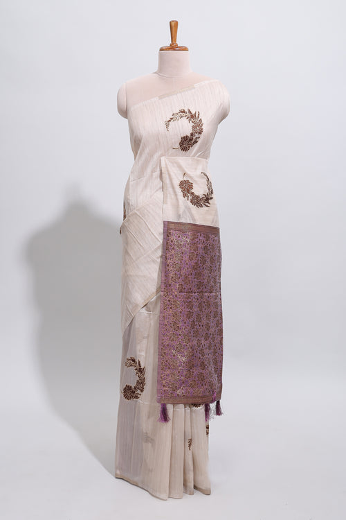 Borderless cream floral design art tussar saree with contrast pallu and motifs blouse