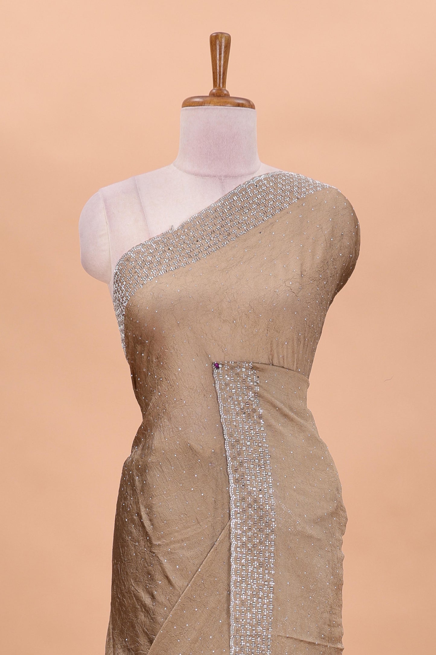 Gold chiffon georgette crush saree with all-over stone work, stone & beads border, and short stone work pallu with contrast embroidery blouse