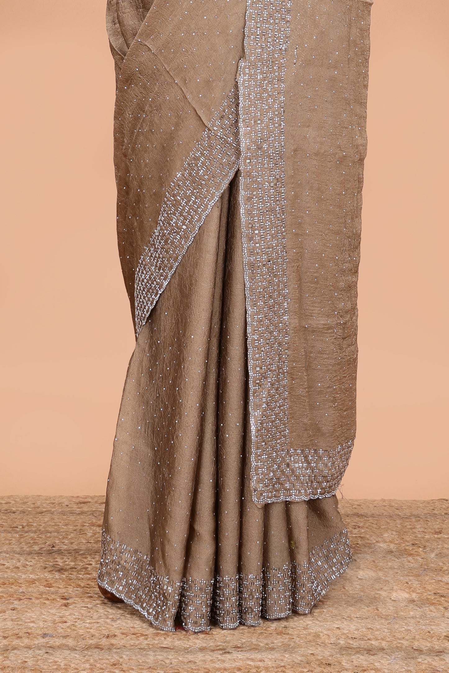 Gold chiffon georgette crush saree with all-over stone work, stone & beads border, and short stone work pallu with contrast embroidery blouse