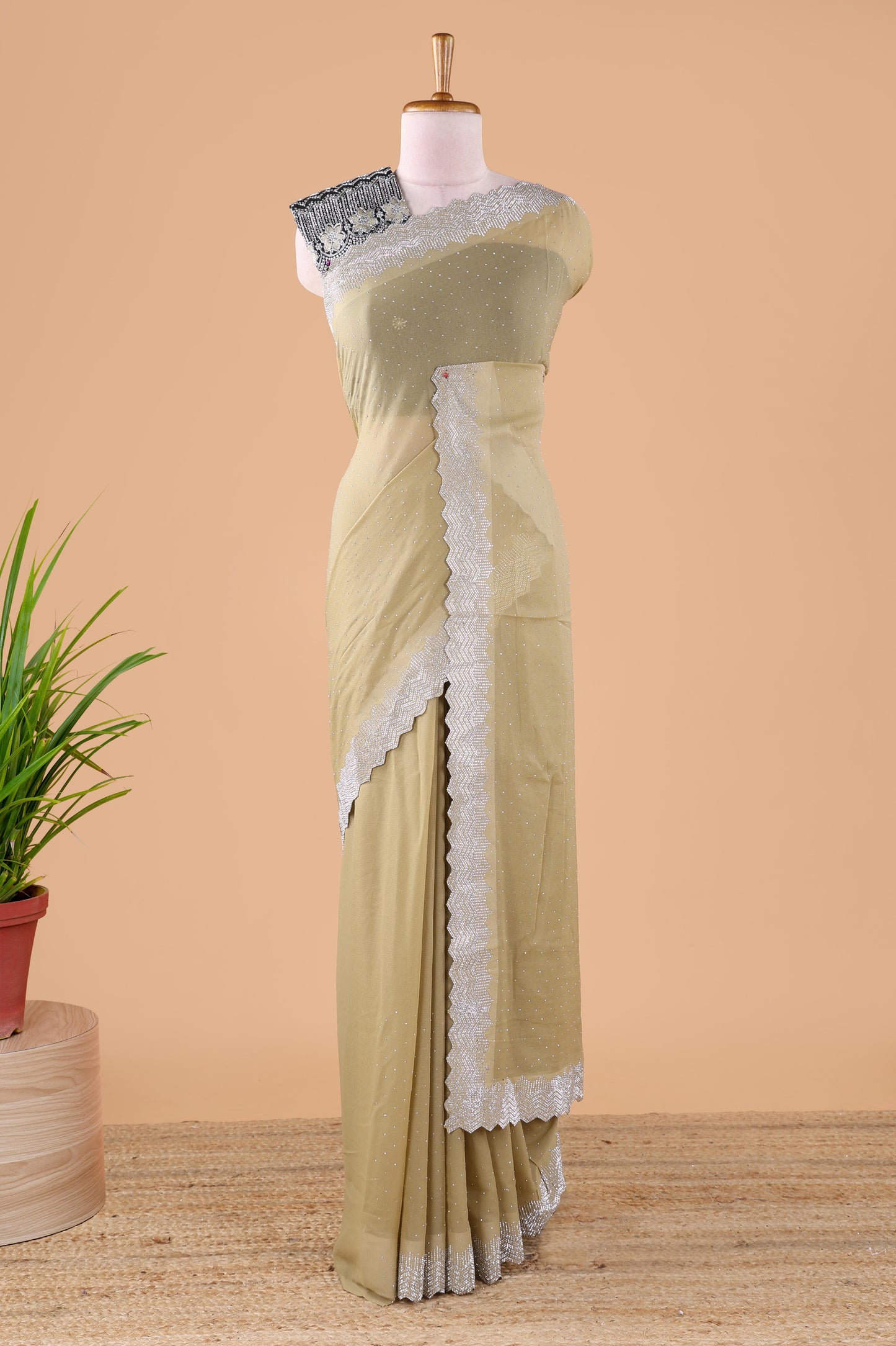 Green designer georgette space silk saree with heavy stone & beads work, short pallu and contrast sequin embroidered blouse