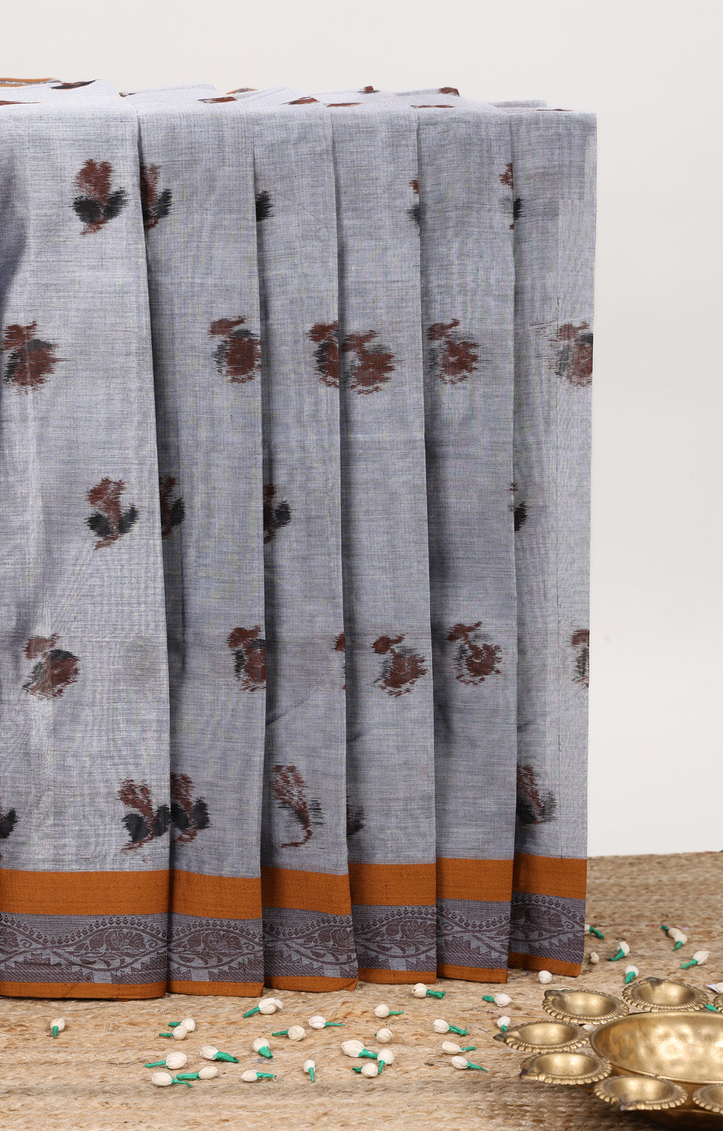 Grey floral butta bengal cotton saree with contrast border and pallu