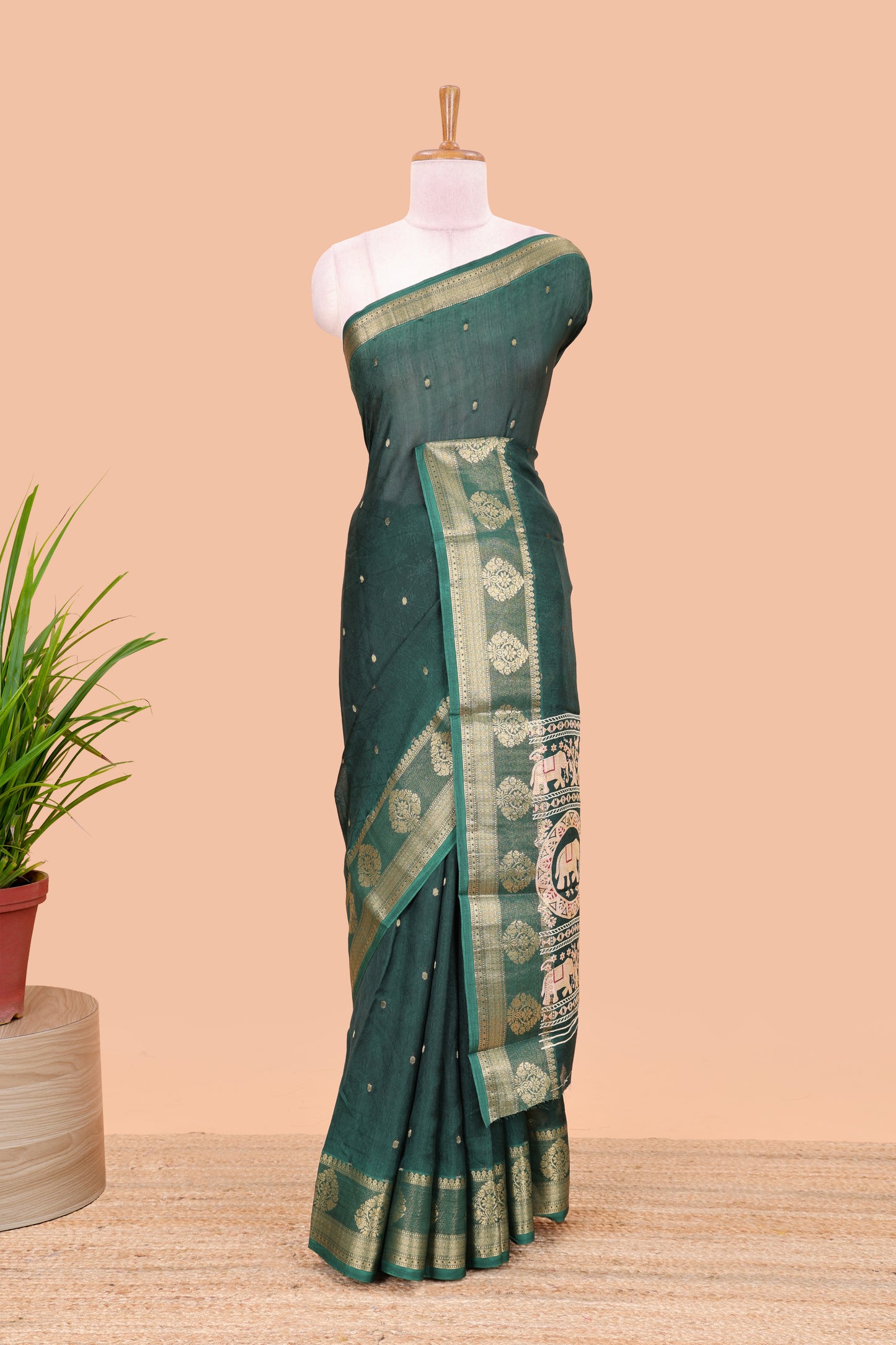 Green viscose dola silk saree with all-over zari butta, elephant motif pallu & contrast blouse