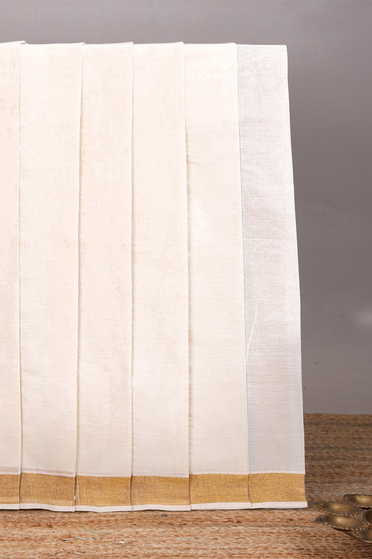 Cream peacock feather motifs design kerala cotton saree with self zari border and krishnan themed pallu