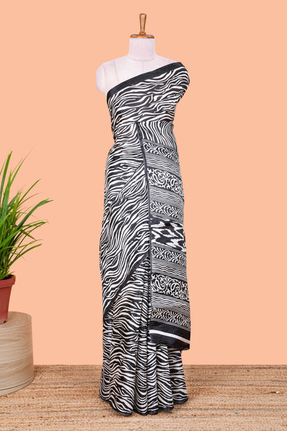 khadi cotton saree with zebra print all over body and pallu along with contrast blouse