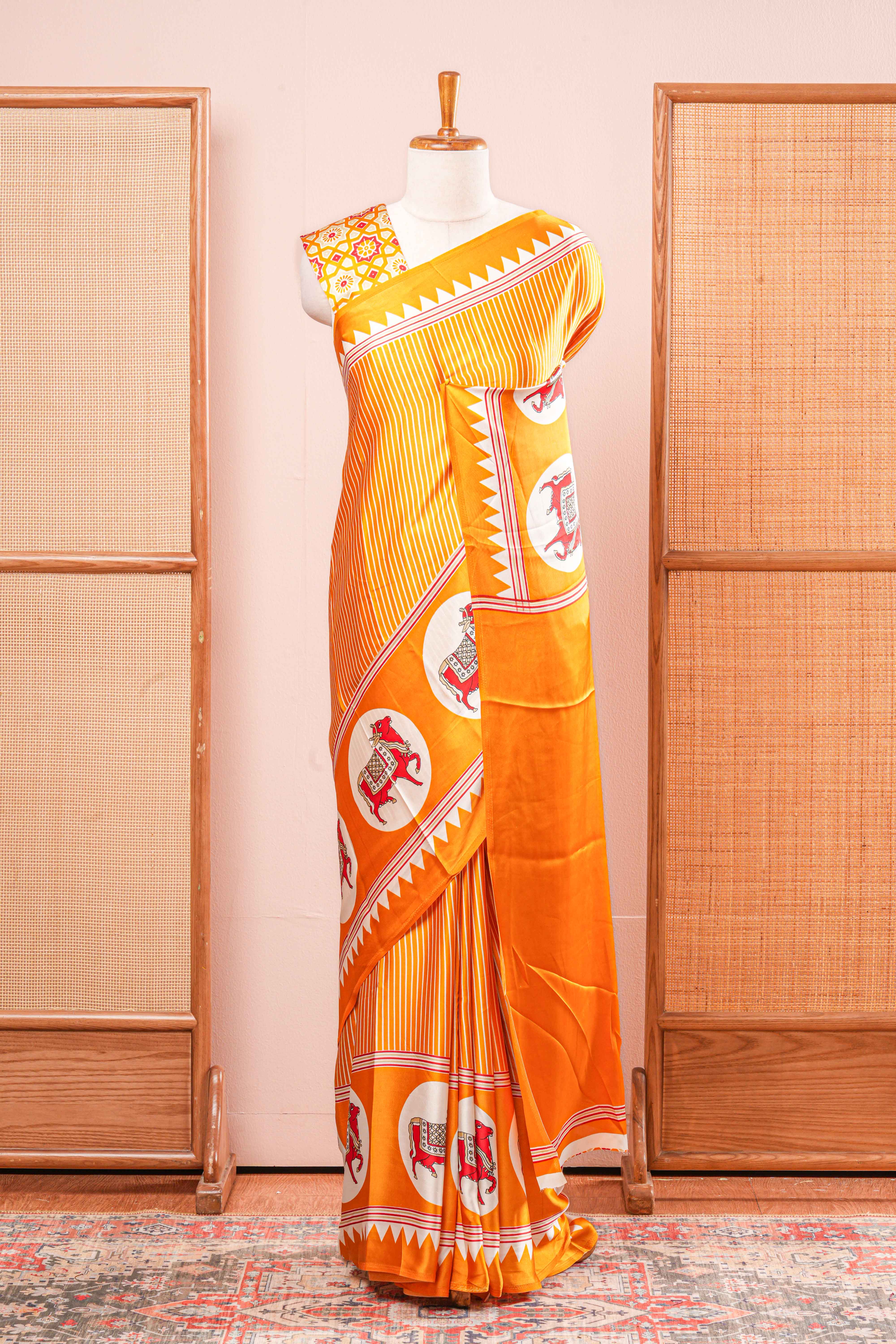 Vibrant Yellow Modal Silk Saree The Body Has Fine Vertical White Stripes The Border Are Highlighted Pichwai Design Along With Ajrakh Printed Blouse