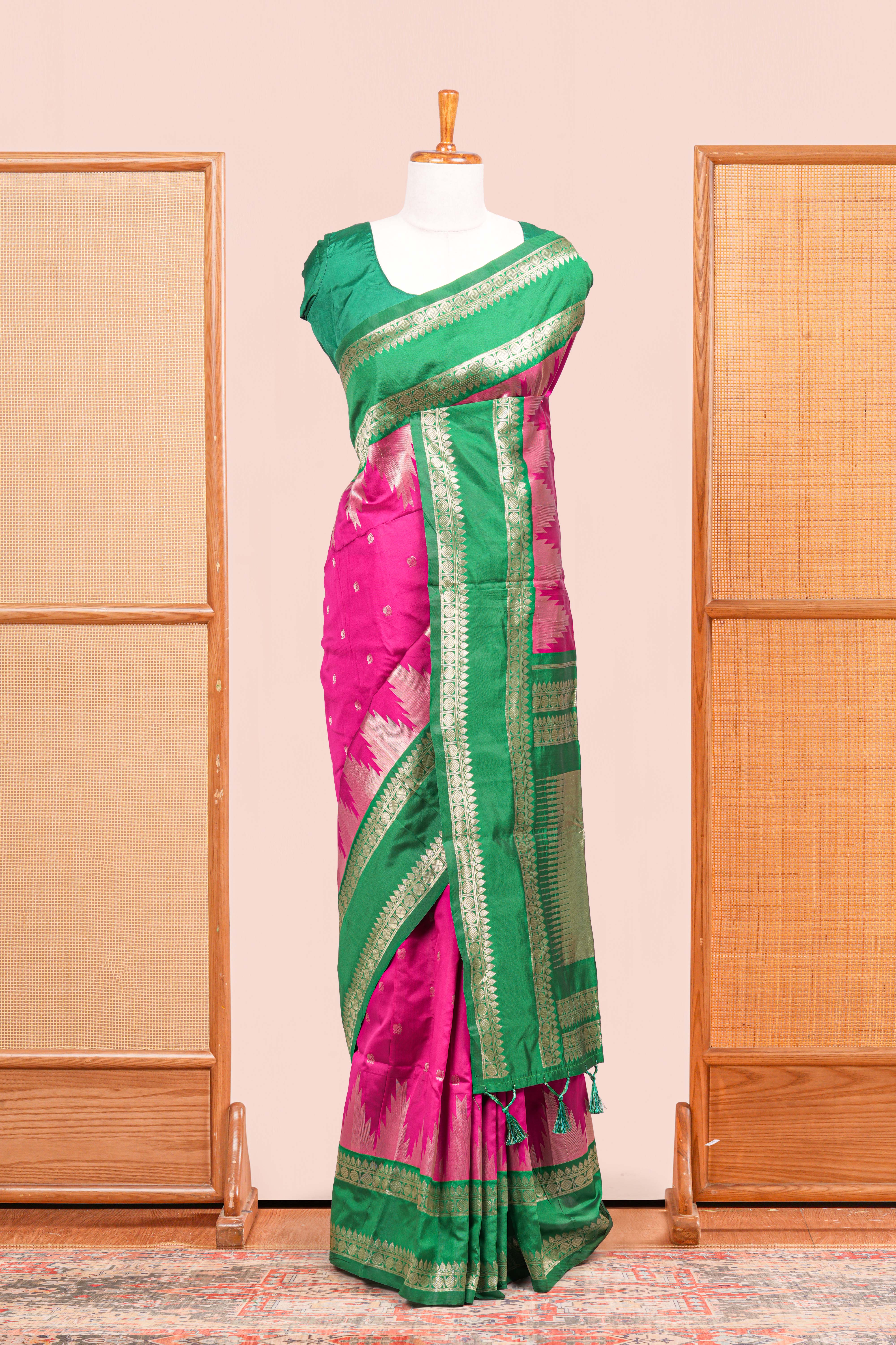 Pink Semi Art Silk Saree Delicate Golden Zari Motifs Along With Thalampoo Zari Woven Across The Body. The Border Is Broad With Intricate Floral Zari Weaving Rich Golden Zari Pallu