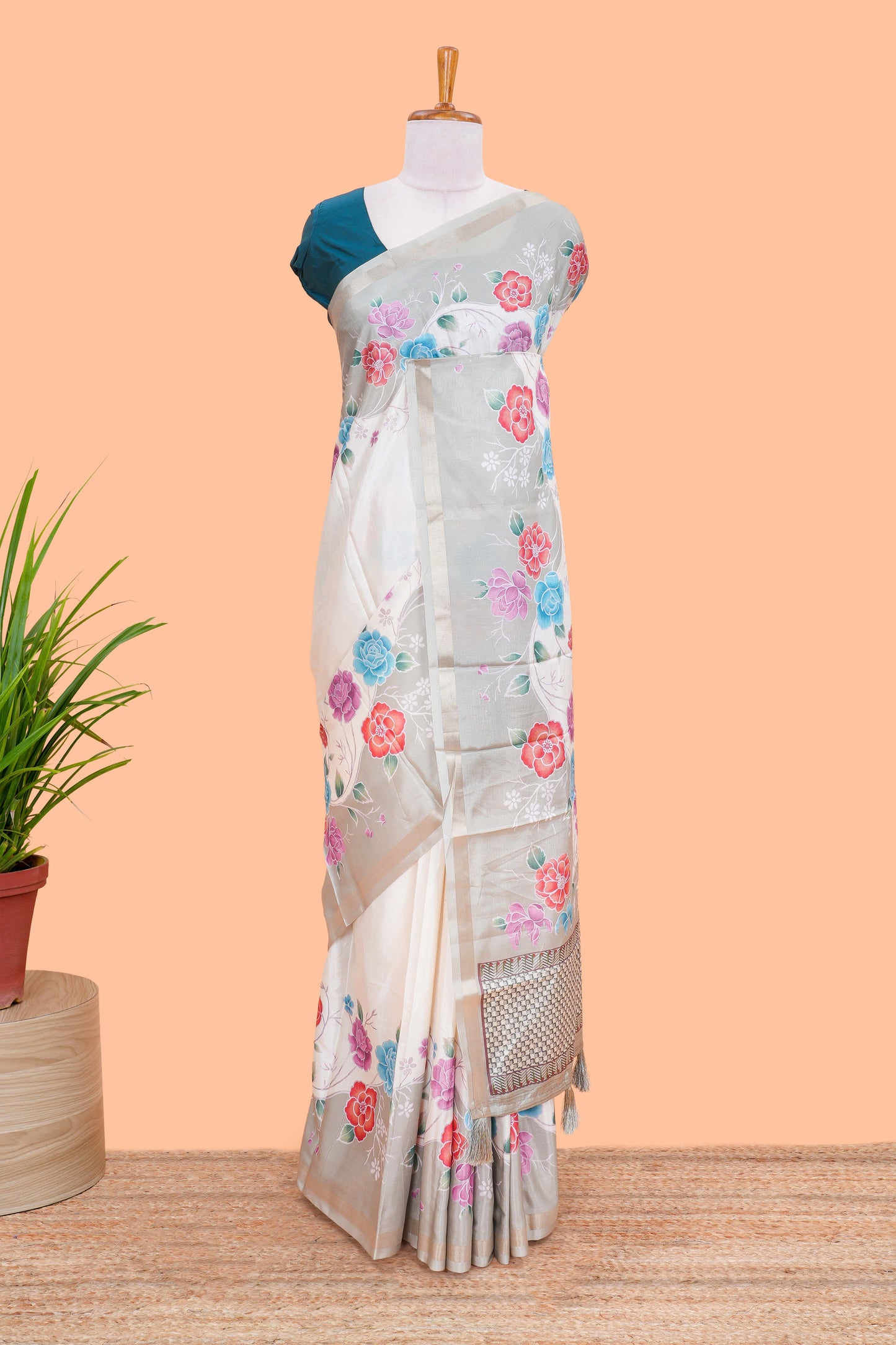 Cream floral vines art tussar saree with contrast pastel green blouse and border