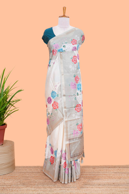 Cream floral vines art tussar saree with contrast pastel green blouse and border