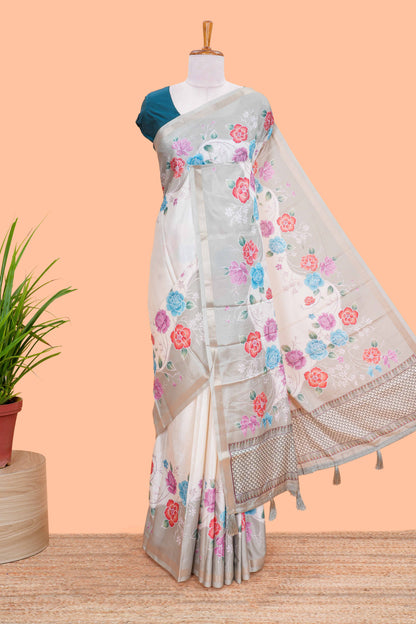 Cream floral vines art tussar saree with contrast pastel green blouse and border